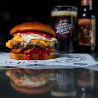 Brunch Burger · Full size only. A half-pound Angus beef and bacon blend patty, topped with cheesy hash crisp...