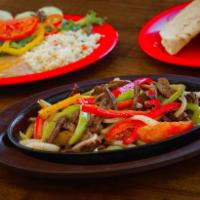 Fajita · Beef, chicken or shrimp. Grilled bell peppers, onions and tomato. Served with rice, beans, s...