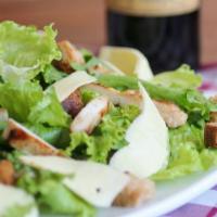 Caesar Salad · Romaine lettuce tossed wth Caesar dressing and topped with Parmesan cheese and croutons. 
