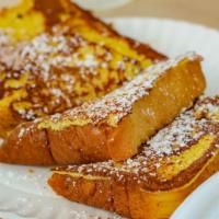 French Toast · Pancakes and French toast served with butter and syrup.