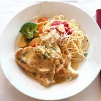 Carciofi  · Chicken scaloppini sauteed with garlic and artichokes hearts in a cream sauce. Served with a...