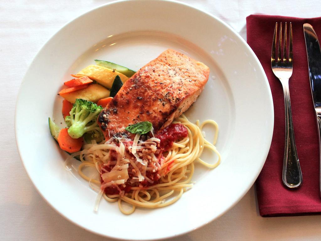Salmon  · Atlantic salmon blackened or grilled and served in a lemon white wine sauce. Served with a side of pasta, a side of vegetables and a salad.