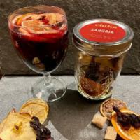 Sangria · Made with Dehydrated Orange wheels, Peach Chips, Apple, Sweet Citrus, and dried Hibiscus.