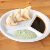 Vegetable Samosa · The most popular Indian appetizer.  Deep fried pastry stuffed with potatoes and peas. Dairy ...