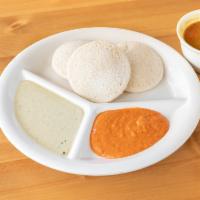 Idly · Steamed rice cakes served with chutney and sambar. Low fat, dairy free, vegan, nut free, glu...