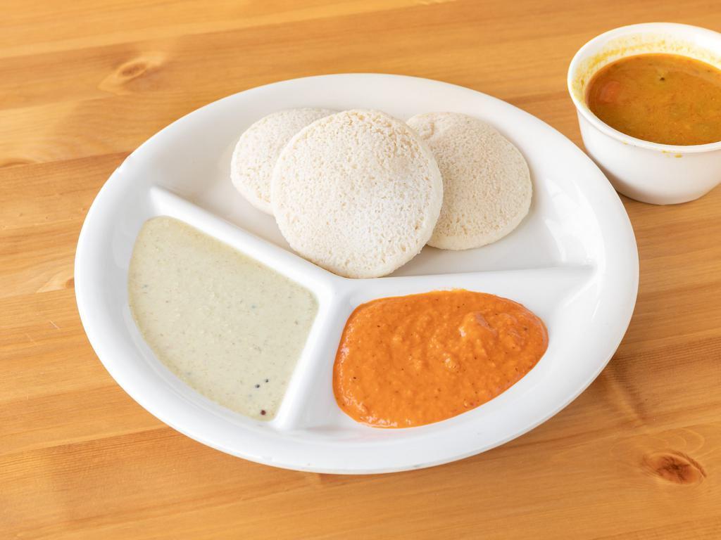 Idly · Steamed rice cakes served with chutney and sambar. Low fat, dairy free, vegan, nut free, gluten free, vegetarian.