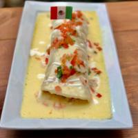 Maestro Burrito · Filled with rice, beans, chicken, and chorizo, topped with cheese dip, pico de gallo, and cr...