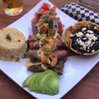 Mar y Tierra · 8 oz. grilled fillet mignon served with rice, black refried beans, six grilled shrimp, grill...