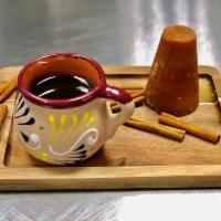 Cafe de Olla · Traditional black coffee made with piloncillo y cinnamon sticks.