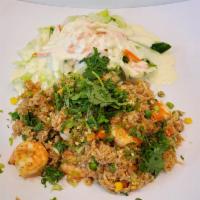31. Shrimp Fried Rice · 6 pieces shrimp.
Served w/salad - topped w/scallion & cillantro