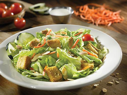 SIDE GARDEN SALAD · Fresh greens, carrots, cucumbers, croutons, toasted almonds & grape tomatoes. Choice of dressing.