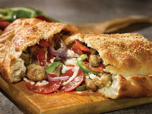 CHICAGO 7™ CALZONE · Pepperoni, Italian sausage, red onions, black olives, green peppers, sliced mushrooms, mozzarella, ricotta.