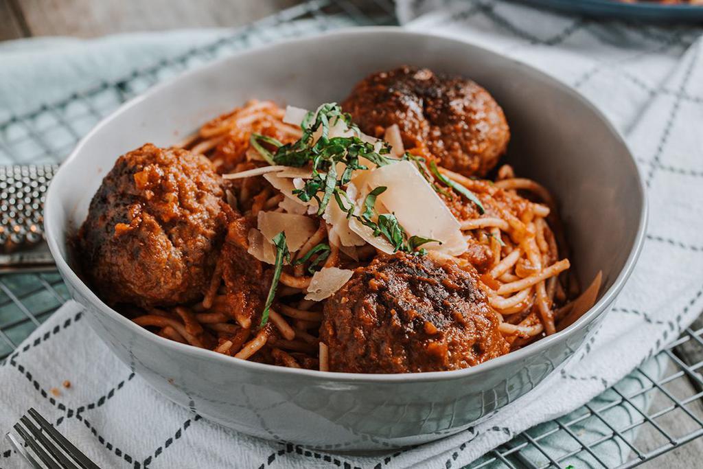 SPAGHETTI & MEATBALLS · Italian sausage & ground beef meatballs with spaghetti, signature red sauce, fresh basil & parmesan cheese.