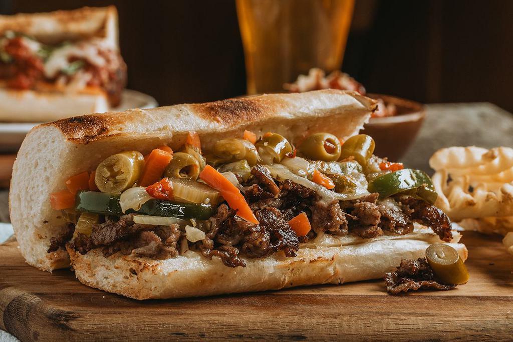 CHICAGO CHEESESTEAK SANDWICH  · Certified Angus beef, sautéed peppers & onions, pepperjack cheese & hot giardiniera.