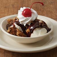 OC KIDS SUNDAE · Two scoops of vanilla ice cream with chocolate syrup, whipped cream, chocolate chip cookie c...