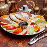 Pancake Special  · 3 Pancakes topped with whipped cream, comes with syrup and fresh fruits. 