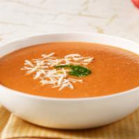 Tomato Basil · Fresh, ripe tomatoes, basil and onions blended into a smooth, creamy soup. Topped with crout...