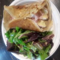 CP7. La Brie Crepe · Crepe with parisian ham and melted Brie cheese. Served with a side of mesclun mix salad. Mad...