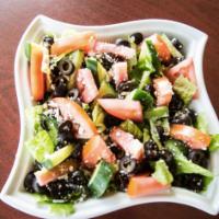 Greek Salad · Lettuce, tomatoes, cucumber, black olives and feta cheese with Italian dressing. Vegetarian.
