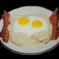 #9 Biscuits & Gravy · Biscuits with gravy, two eggs cooked to order and two pieces bacon or sausage.
