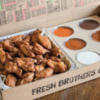 Wings Bundle · 50 bone-in, boneless or mix of our famous baked wings with choice of 6 sauces. (each additio...