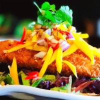 Golden Mango · Fried Tilapia with lightly panko, on bed of greens and side of a mixture of mango, red onion...