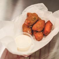 Jalapeno Poppers · 6 pieces. Stuffed with cream cheese and fried to perfection. Served with ranch.