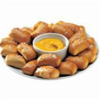 Warm Pretzel Bites · Warm and soft pretzel bites served with a dipping sauce of your choice.