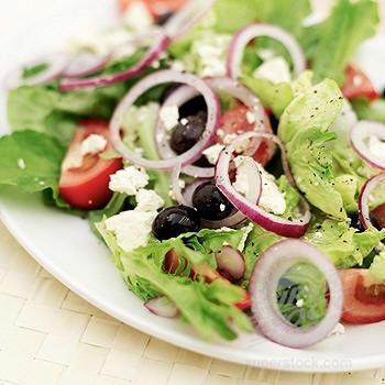 Greek Salad · Romaine, iceberg, cucumbers, tomatoes, artichoke hearts, Kalamata olives, red onions, croutons, feta crumbles and Greek dressing.