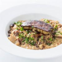 Porcini Risotto with Sauteed Foie Gras · Risotto with porcini, mixed mushrooms and parmesan cheese with sauteed foie gras and balsami...
