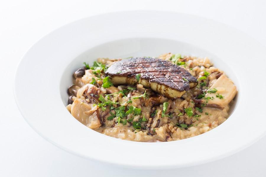Porcini Risotto with Sauteed Foie Gras · Risotto with porcini, mixed mushrooms and parmesan cheese with sauteed foie gras and balsamic reduction.