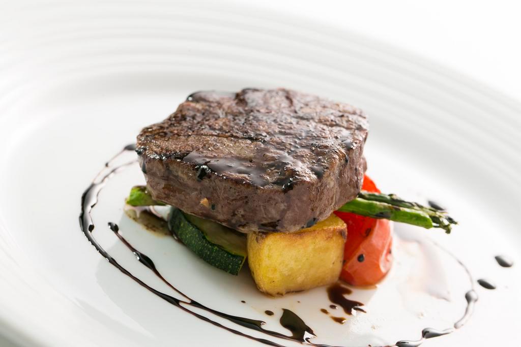 Filet di Manzo alla Griglia · Grilled USDA prime beef tenderloin with a balsamic reduction served with grilled vegetables.