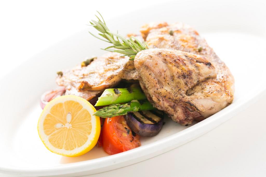 Grilled Chicken with Brown Butter Caper Sauce · Chicken breast and thigh with lemon butter, garlic and capers served with grilled vegetables.