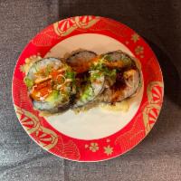 Devil Mountain Roll (9 pcs) · Deep-fried spicy salmon cream cheese roll topped with tobiko spicy sauce.
