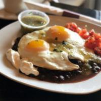 Huevos Rancheros · Two eggs sunny side up, black beans, cheese, avocado, salsa verde, sour cream and corn torti...