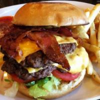 Swan Bacon Double Cheeseburger · Two 4oz ground beef patties, bacon, cheese, lettuce, onion and tomato on a bun with french f...