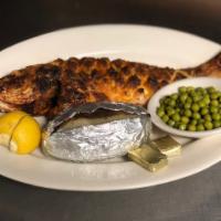 Broiled Whole Red Snapper · Free garlic bread with your order 