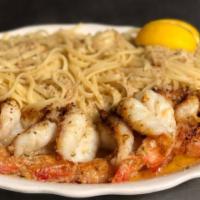Shrimp Scampi with Linguini or Rice  · Free garlic bread with your order 
