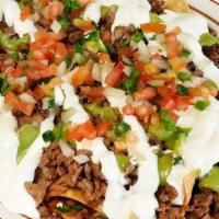 Super Nachos · Choice of meat. With Cheese, beans, sour cream, guacamole, pico de gallo and your choice of ...