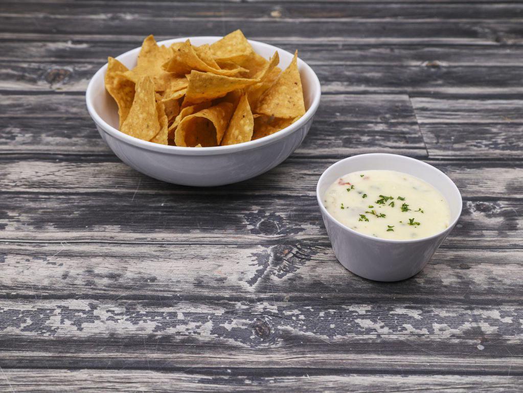 Queso Delgado · Pablo's famous queso blanco topped with pico served with fresh tortilla chips.