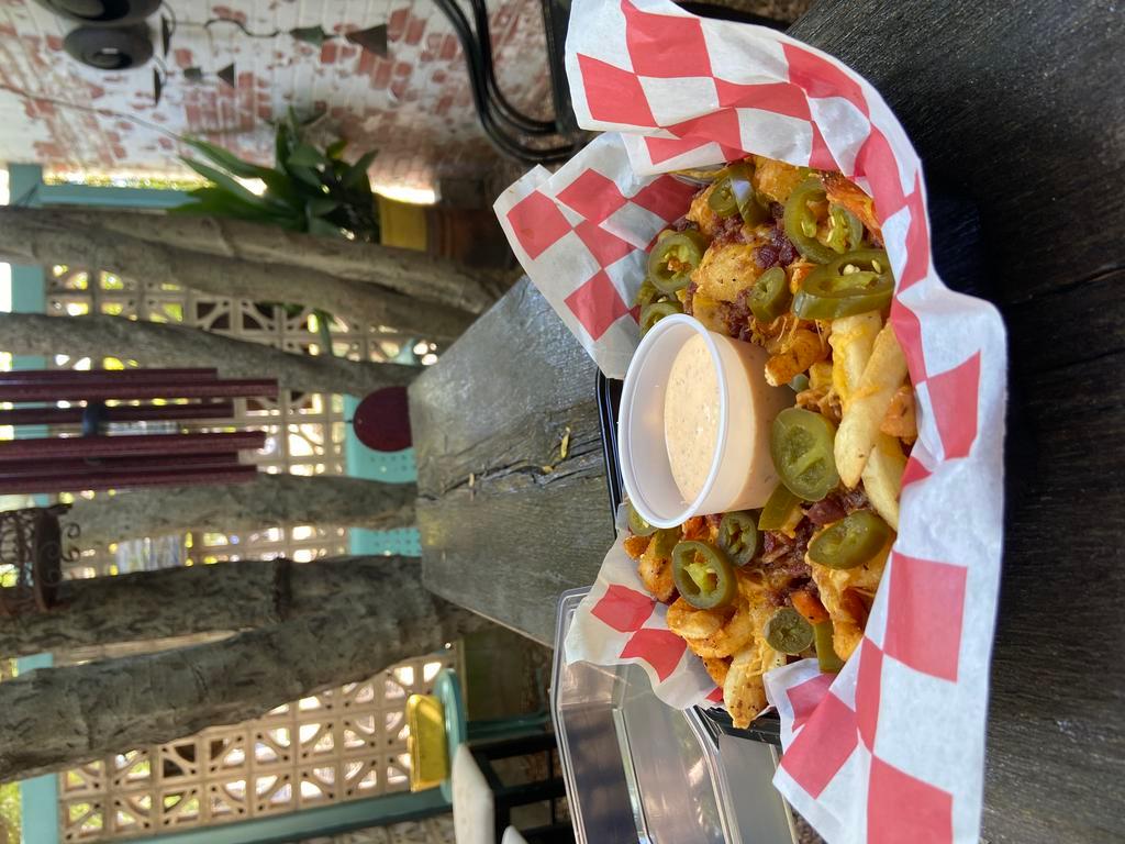 Loaded Fries · topped with cheddar, bacon and jalapenos with choice of ranch or spicy ranch