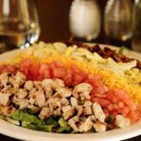 Cobb Salad · Bed of mixed greens, topped with grilled chicken, bacon, cheddar, hard boiled egg, diced tom...