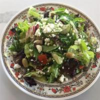 27. Greek Salad · Vegetarian. Mixed greens, lettuce, tomatoes, cucumbers and onions topped with feta cheese an...