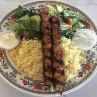 10. Chicken Kabob · 2 chicken skewers served with rice pilaf, salad, tzatziki, and garlic sauce.