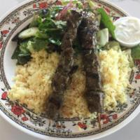 11. Beef Kabob · 2 beef skewers served with rice pilaf, salad, and tzatziki.