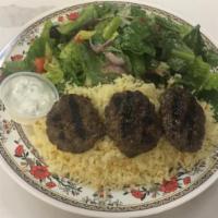 13. Kafta Kabob · 3 ground beef patties served with rice pilaf, salad, and tzatziki.