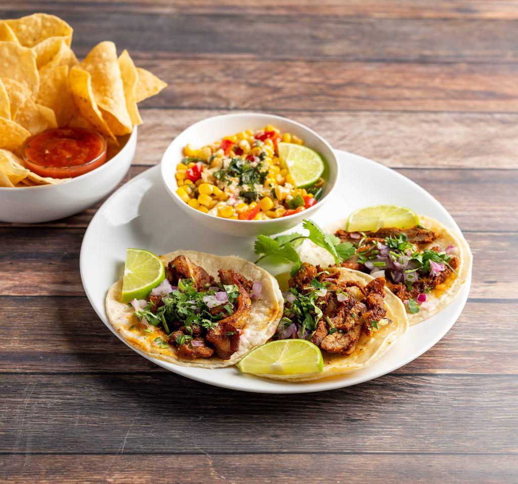Al Pastor Pork Plate · 3 street tacos with pastor pork, onion and cilantro. Served with chips and salsa, steamed white corn tortillas and your choice of one side.