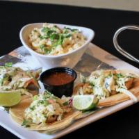 Tempura Fish Los Cabos Plate · 3 street tacos, jalapeno slaw and cilantro. Served with chips and salsa, steamed white corn ...