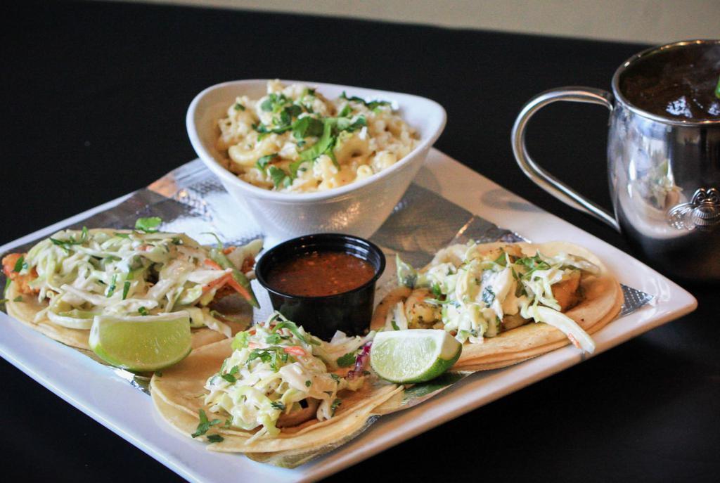 Grilled Fish Los Cabos Plate · 3 street tacos, jalapeno slaw and cilantro. Served with chips and salsa, steamed white corn tortillas and your choice of one side.