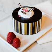 Le Creme - Chocolate Chambord · Chocolate cake with raspberry filling served with fresh fruit and your choice of tea